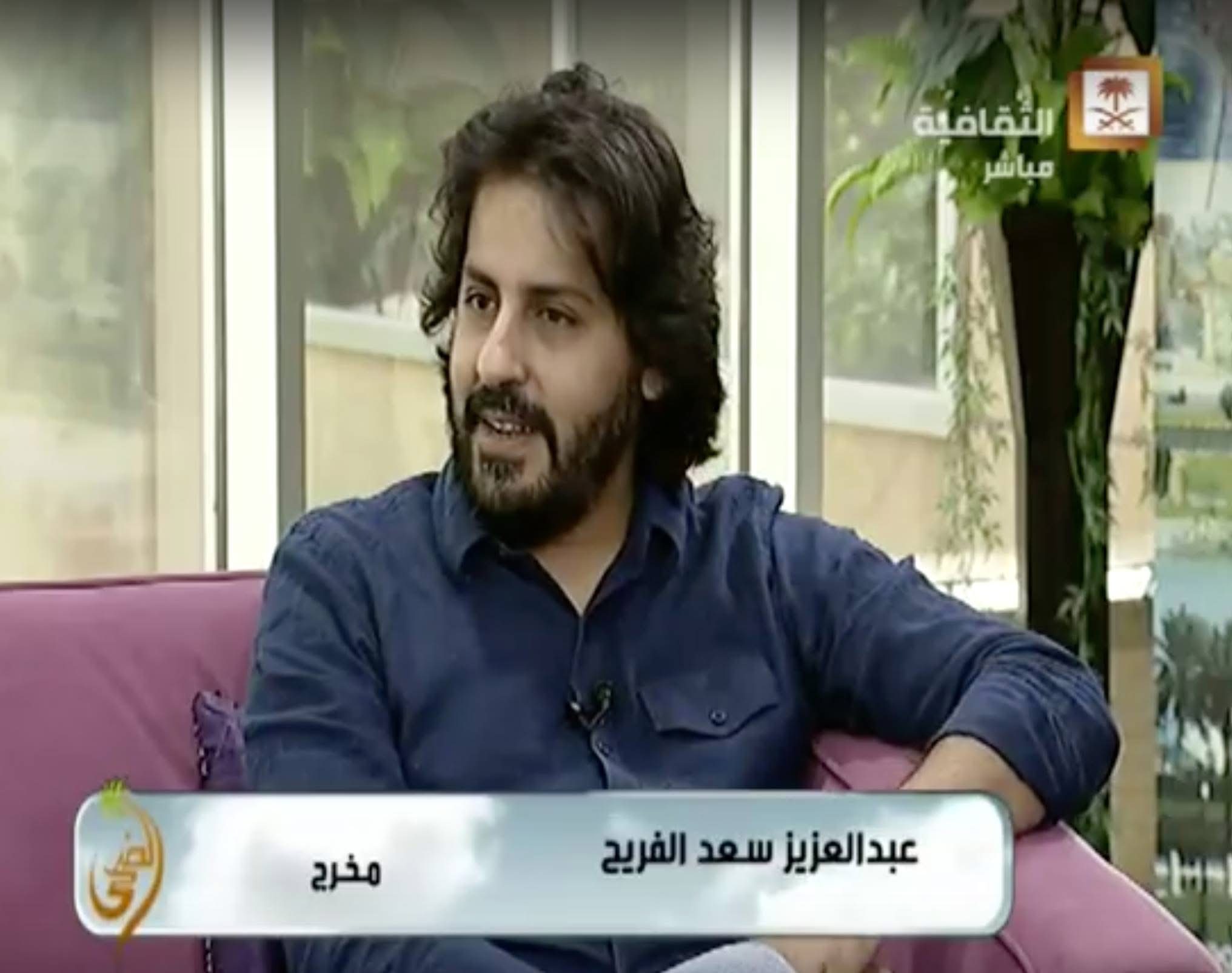 Abdulaziz Alfuraih during an outdoor television interview